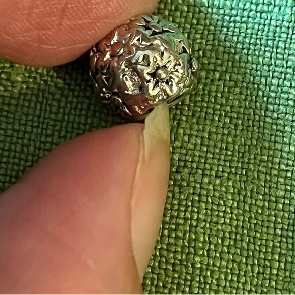 Pandora silver charm with flower design, approximately 1/3rd of an inch around. - Picture 5 of 5